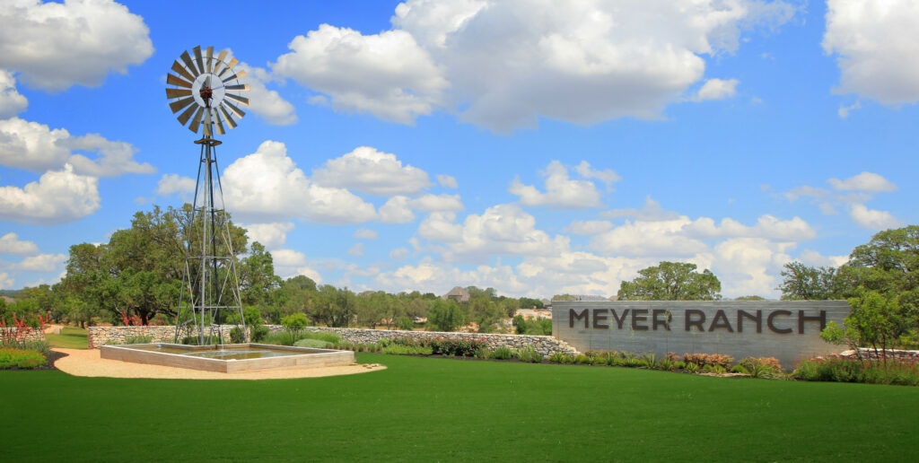 Meyer Ranch entrance with welcome sign and decorative steel windmill