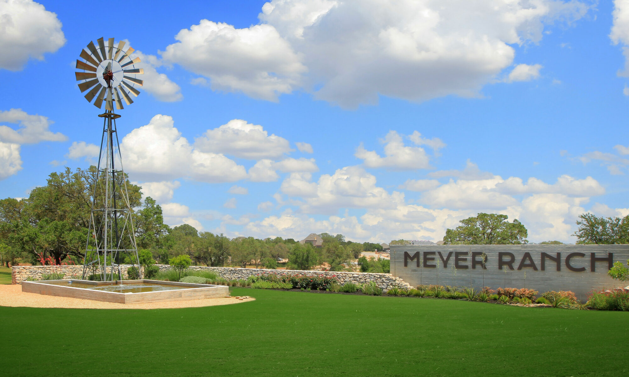 Meyer Ranch entrance with welcome sign and decorative steel windmill