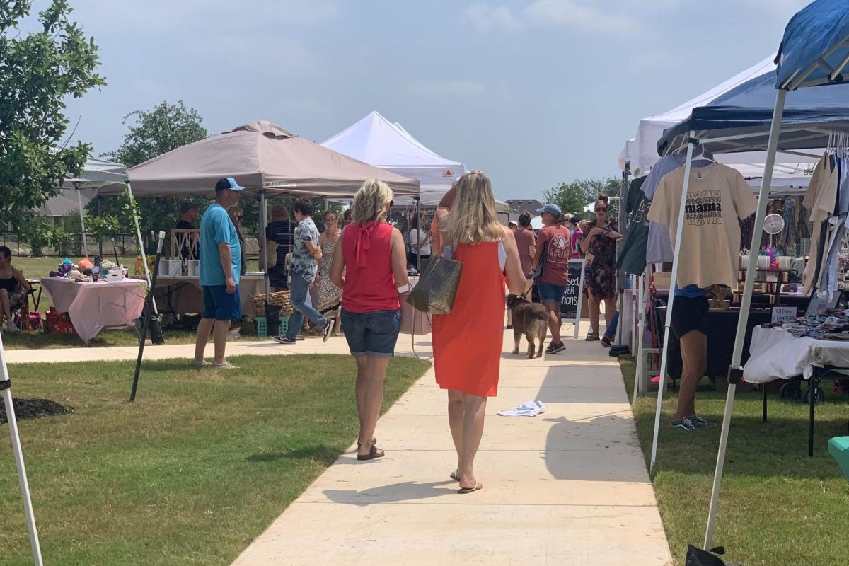 Residents walking around the Meyer Ranch Farmers Market
